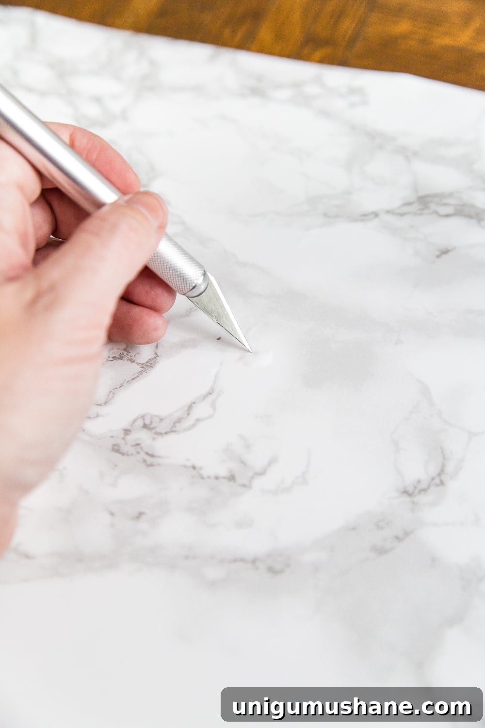 Contact paper tip - poke small holes in air bubbles to press them out