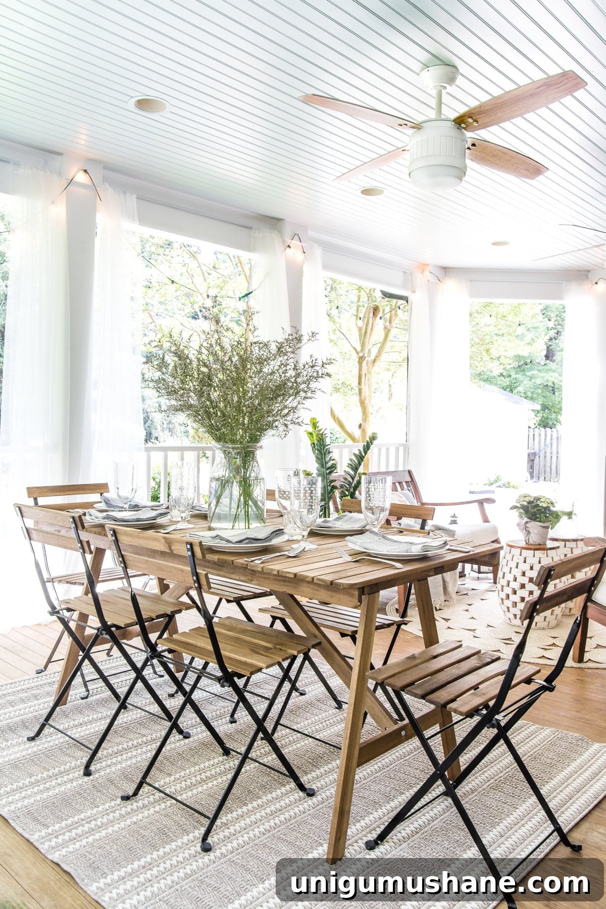 Summer Back Porch Tour: Inspiring Decor and Outdoor Styling 12 outdoor dining table on back porch with haint blue ceiling and ceiling fan