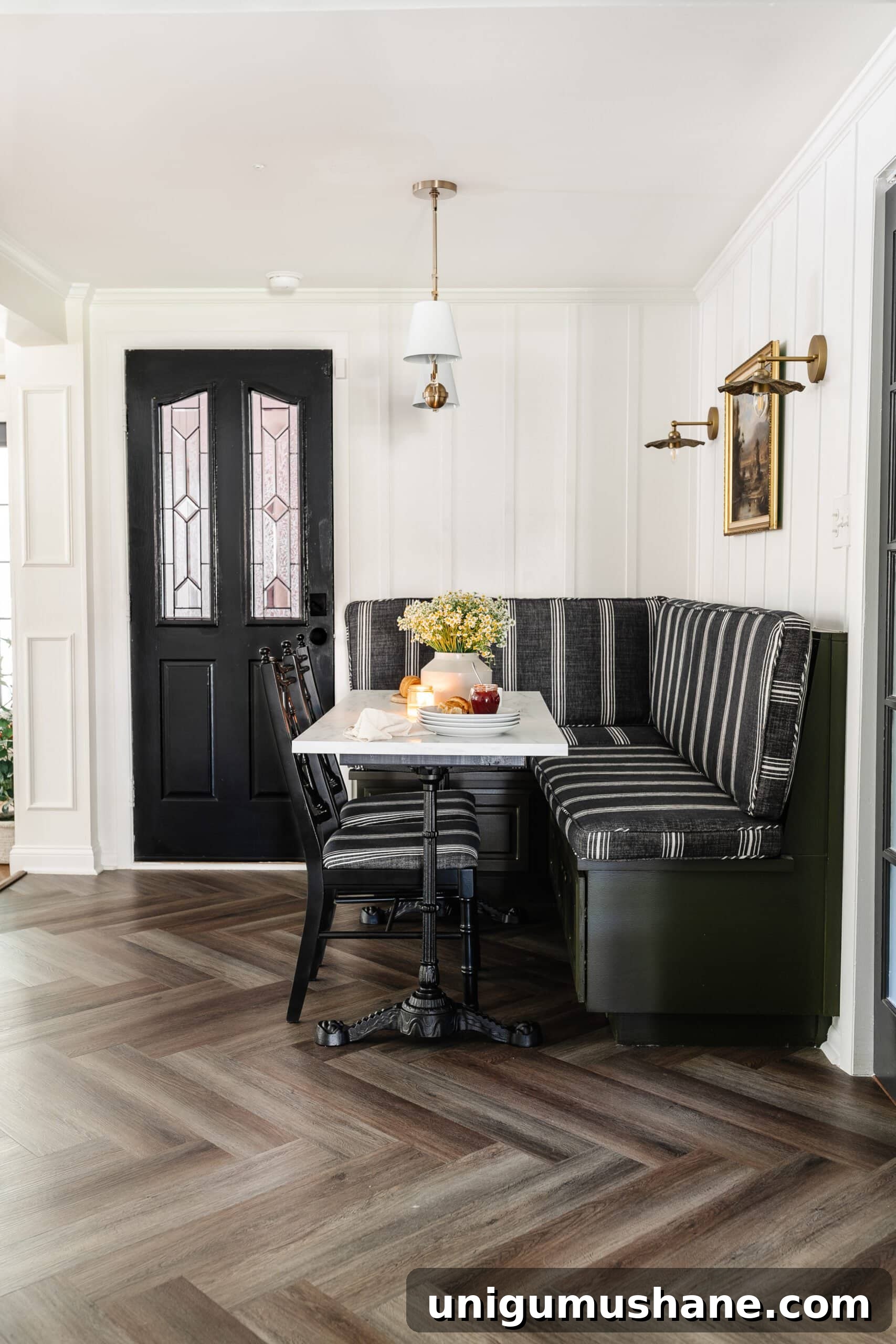 23 Small Room Tricks That Make Any Space Look Bigger 21 breakfast nook with marble table and banquette