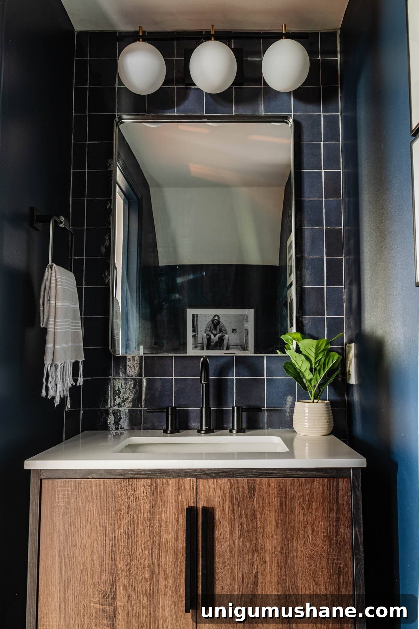 23 Small Room Tricks That Make Any Space Look Bigger 5 small bathroom ideas with navy blue walls and glossy blue tiles