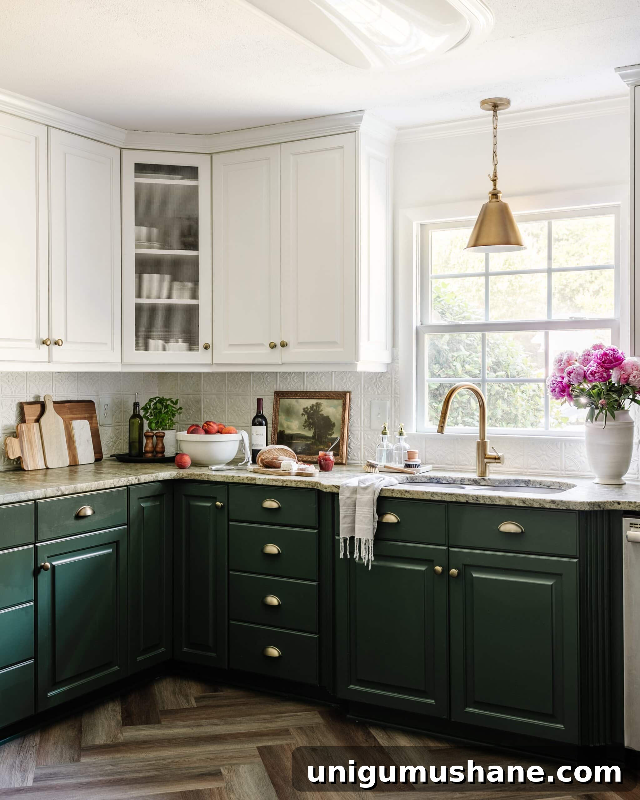 kitchen with white and green cabinets, herringbone floor, pressed tin backsplash, and cottagecore style decor