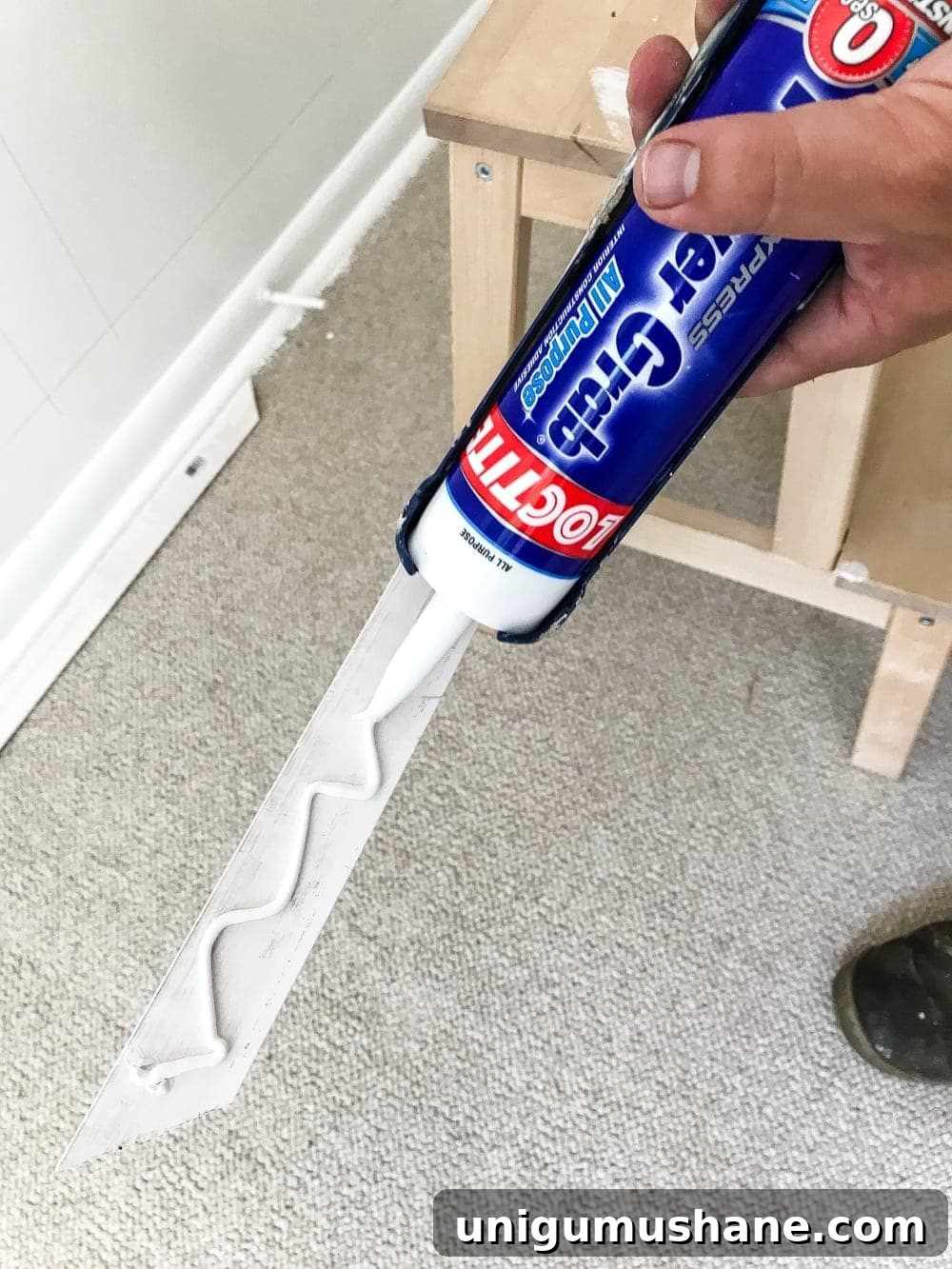 use construction adhesive to make attaching picture frame molding to walls easier