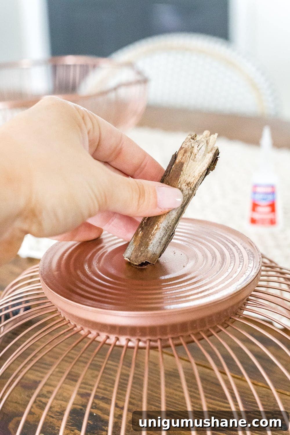 Fall Pumpkin Decor from Wire Baskets and Bundt Pans 6 DIY pumpkin using wire bread baskets and sticks from your yard