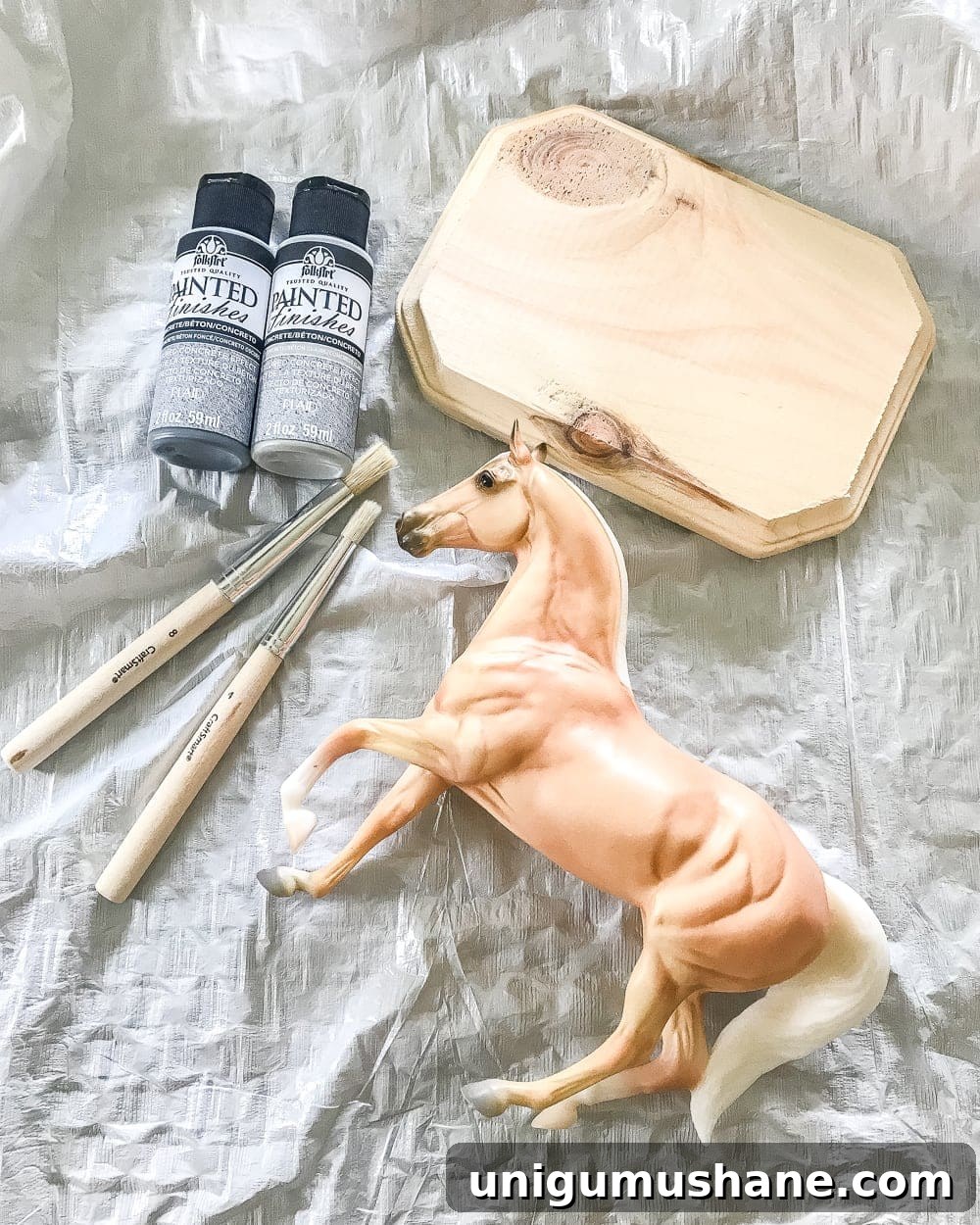 How to Make a Concrete Horse Figurine for Equestrian Decor 3 How to turn a toy horse figurine into a designer-inspired concrete equestrian statuette using just paint, wood craft, and glue. #thriftymakeover