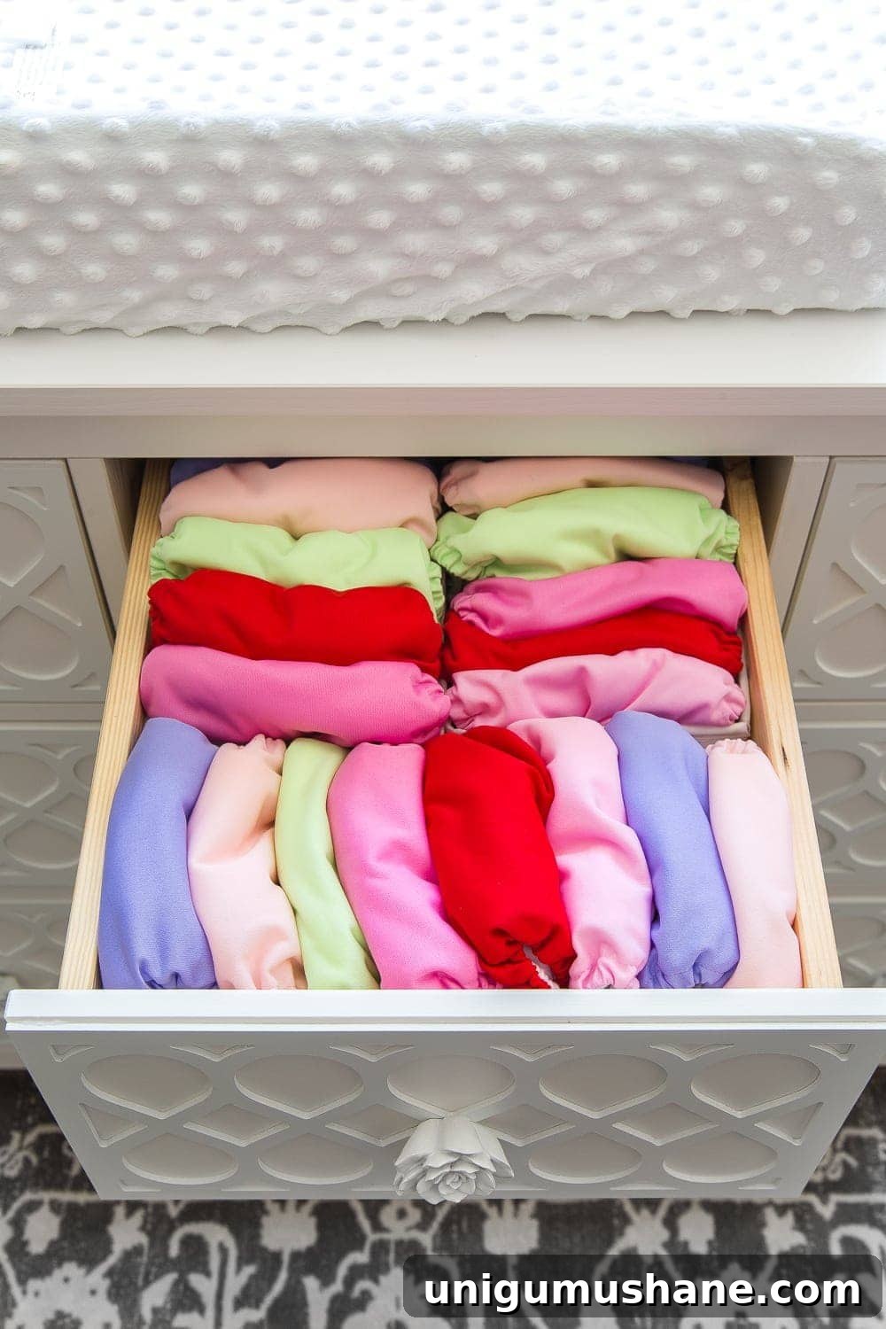 Nursery Organization Tour: Baby Room Storage and Layout 10 Nursery Organization | Dresser drawers with dividers to store cloth diaper covers