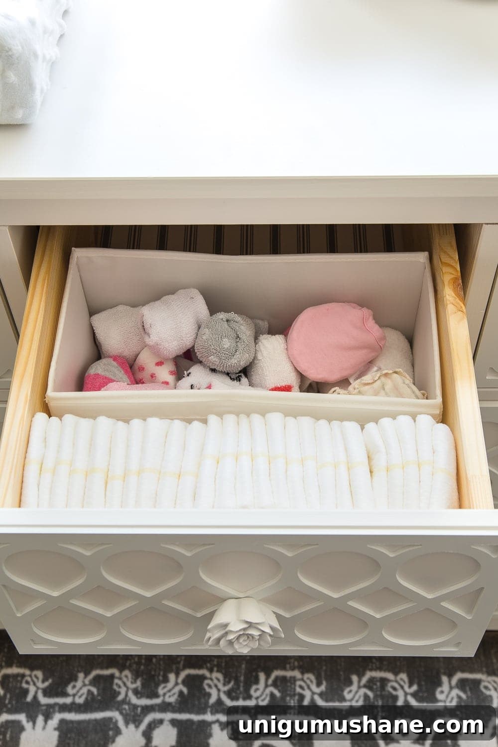 Nursery Organization Tour: Baby Room Storage and Layout 11 Nursery Organization | Dresser drawers with dividers to store diapers, socks, and mittens