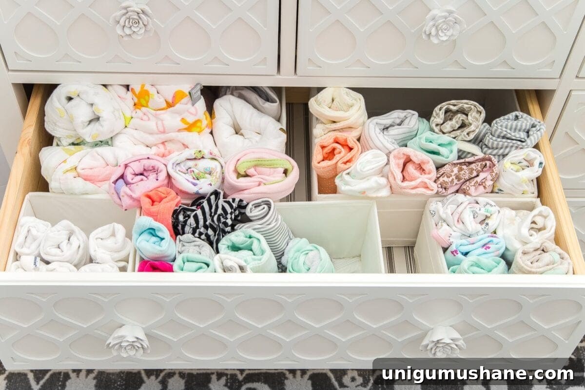 Nursery Organization Tour: Baby Room Storage and Layout 13 Nursery Organization | Dresser drawers with dividers to store baby clothes and swaddles in categories