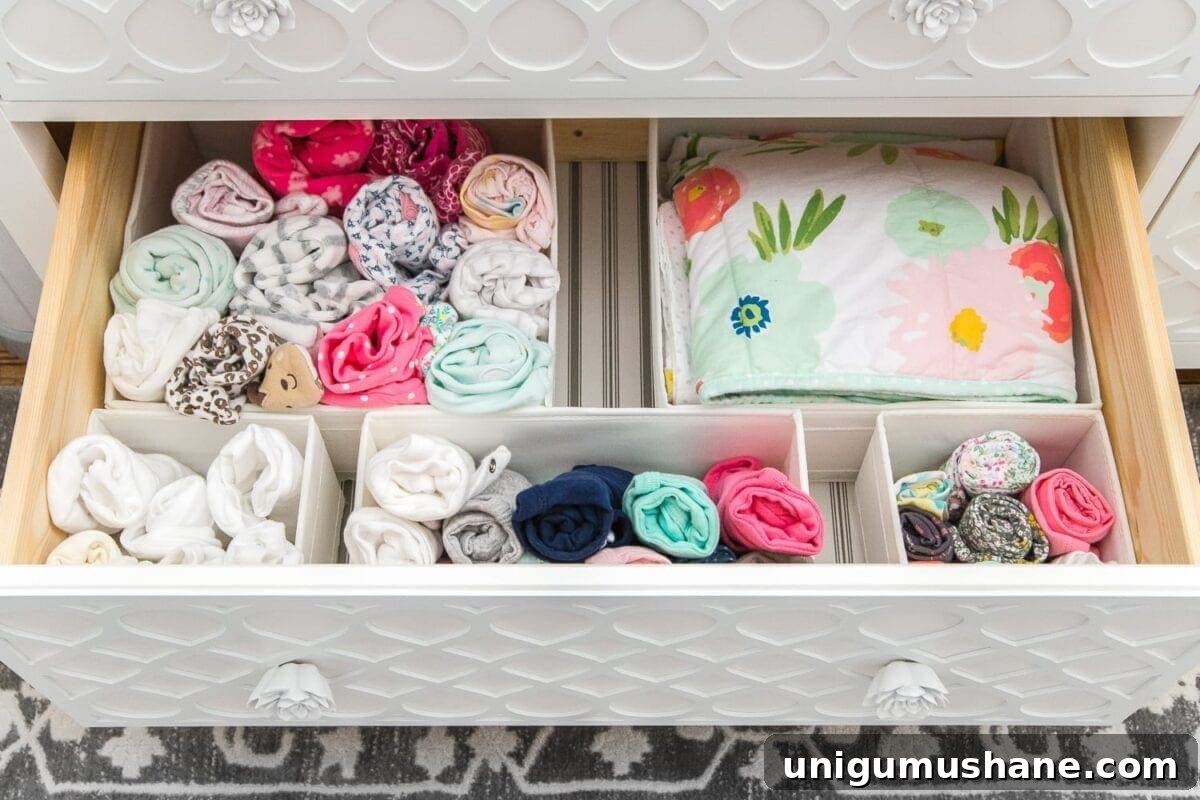 Nursery Organization Tour: Baby Room Storage and Layout 15 Nursery Organization | Dresser drawers with dividers to store clothing in categories.