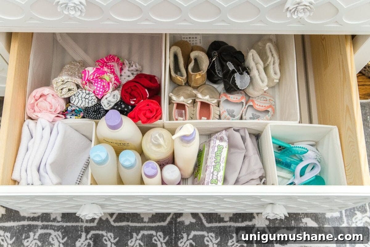 Nursery Organization Tour: Baby Room Storage and Layout 16 Nursery Organization | Dresser drawers with dividers to store baby soap, grooming kit, changing pads, shoes, and diaper pail bags.