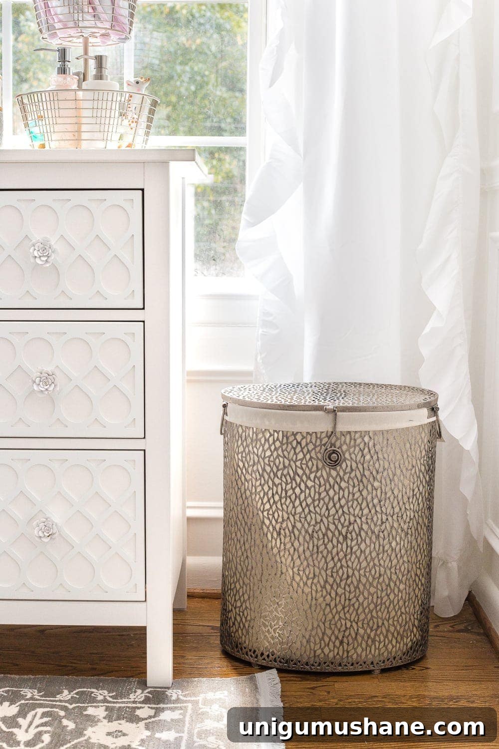 Nursery Organization Tour: Baby Room Storage and Layout 3 Nursery Organization | Use a lidded hamper with a liner for easy washing and to contain baby smells.