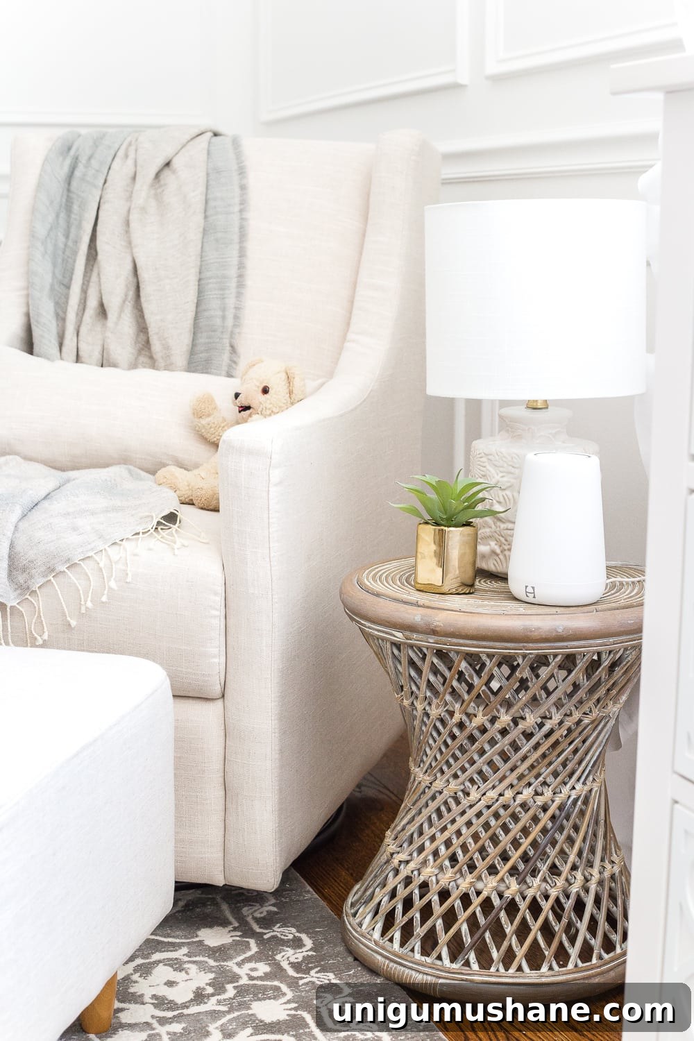 Nursery Organization Tour: Baby Room Storage and Layout 25 Nursery organization | Keep a side table beside a glider with a lamp that has a sleeper bulb (to promote sleep) and a sound machine.