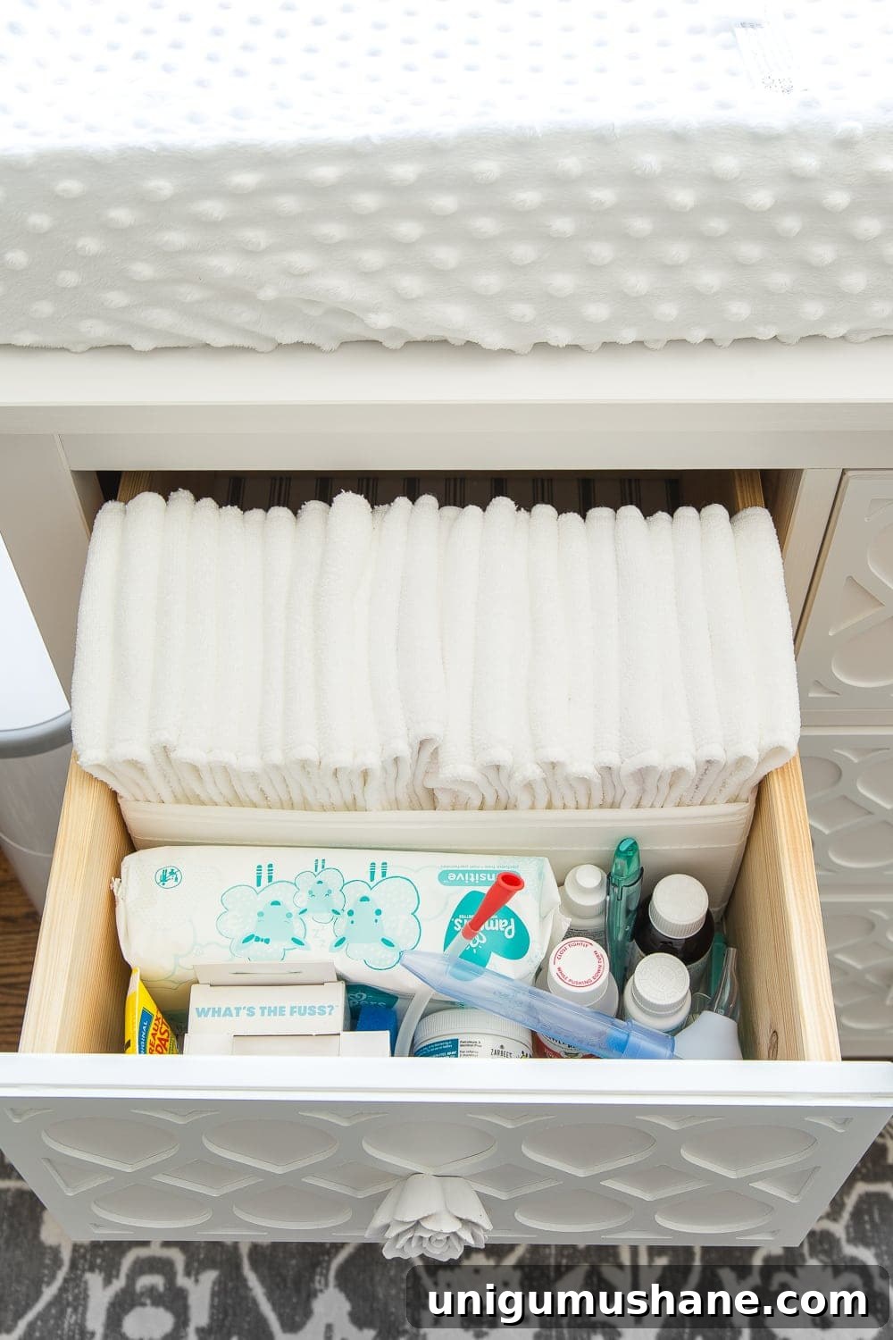 Nursery Organization Tour: Baby Room Storage and Layout 9 Nursery Organization | Dresser drawers with dividers to store cloth diaper liners, medicines, aspirator, thermometer, diaper cream, and wipes.