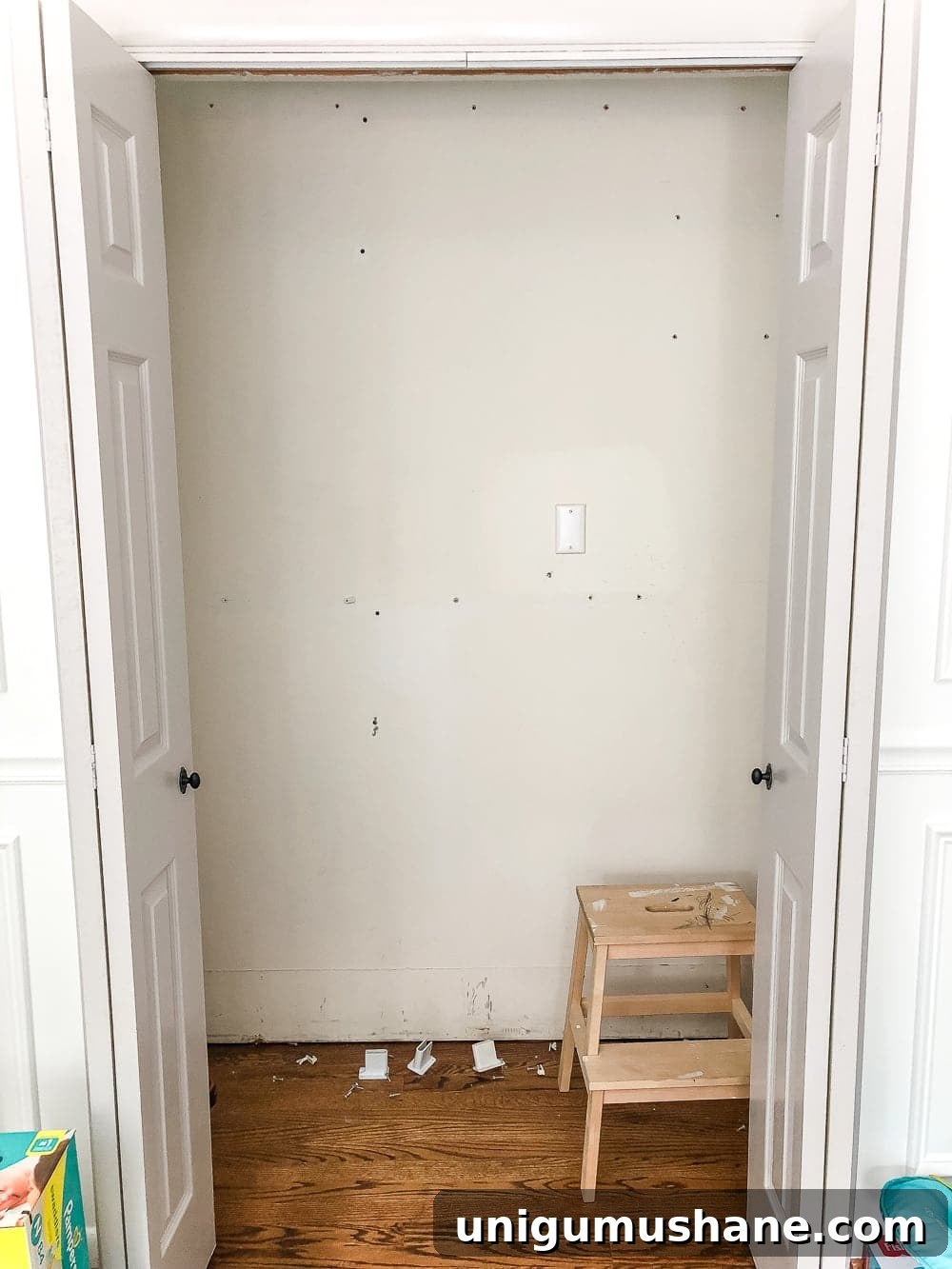 Nursery Closet Makeover Reveal with Free Printable Dividers 5 Nursery closet with wire shelving removed