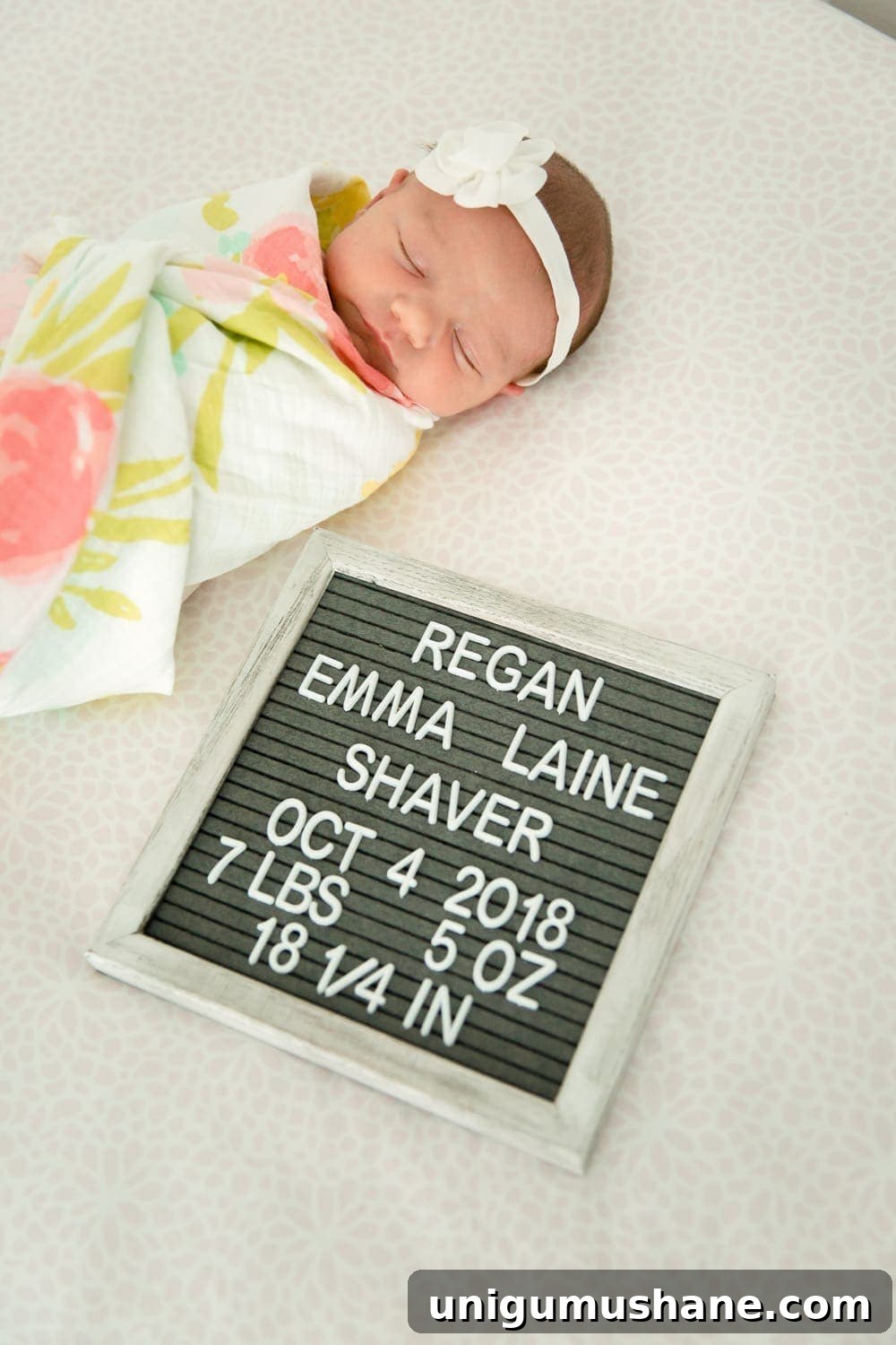 Regan's Birth Story: Welcoming Our Family of Four 2 Newborn baby Regan on a blanket
