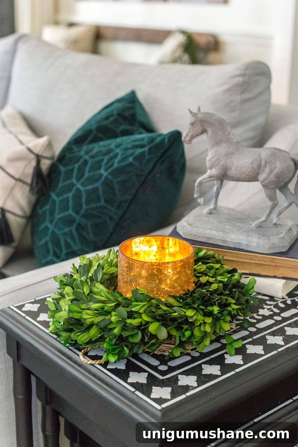 Mini wreath repurposed as a candle ring