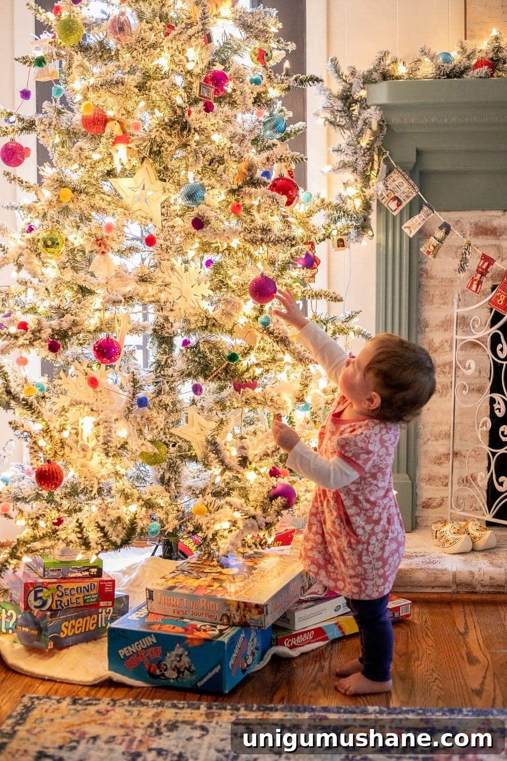 20 DIY Family Christmas Photo Ideas to Capture at Home 4 taking family portraits in front of a tree by facing kids into the light