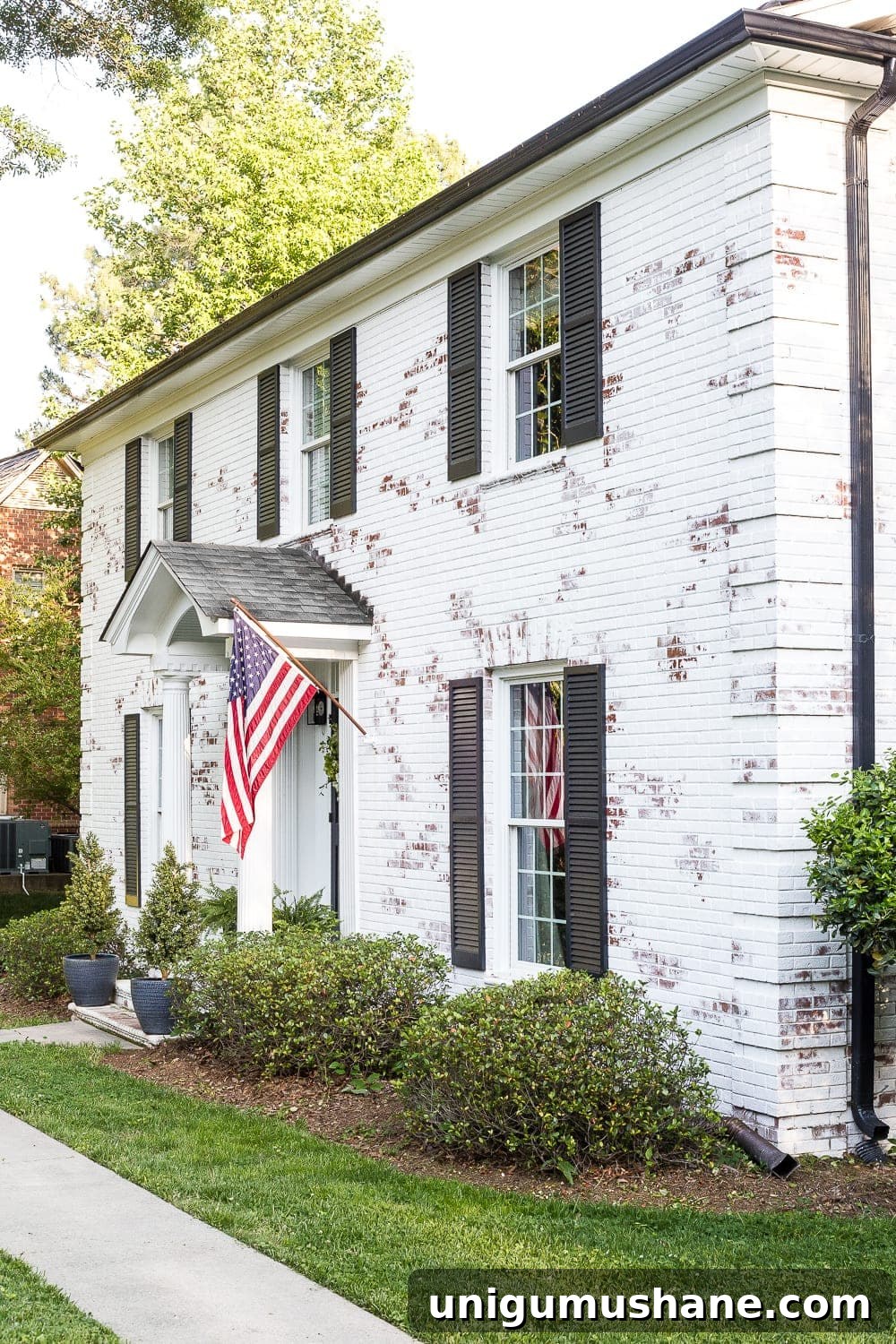 Limewashed Brick FAQ: Country Living Magazine Feature 6 FAQs About Our Limewashed Brick | All of our frequently asked questions about our limewashed brick concerning neighbors' opinions, trends, DIY-ability, and why we chose it over paint. #limewash #brickexterior #limewashedbrick #brickpaint #paintedbrick #exteriormakeover #curbappeal #brickhouse