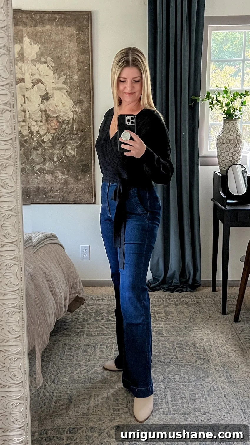 black wrap top and trouser jeans outfit to hide a belly