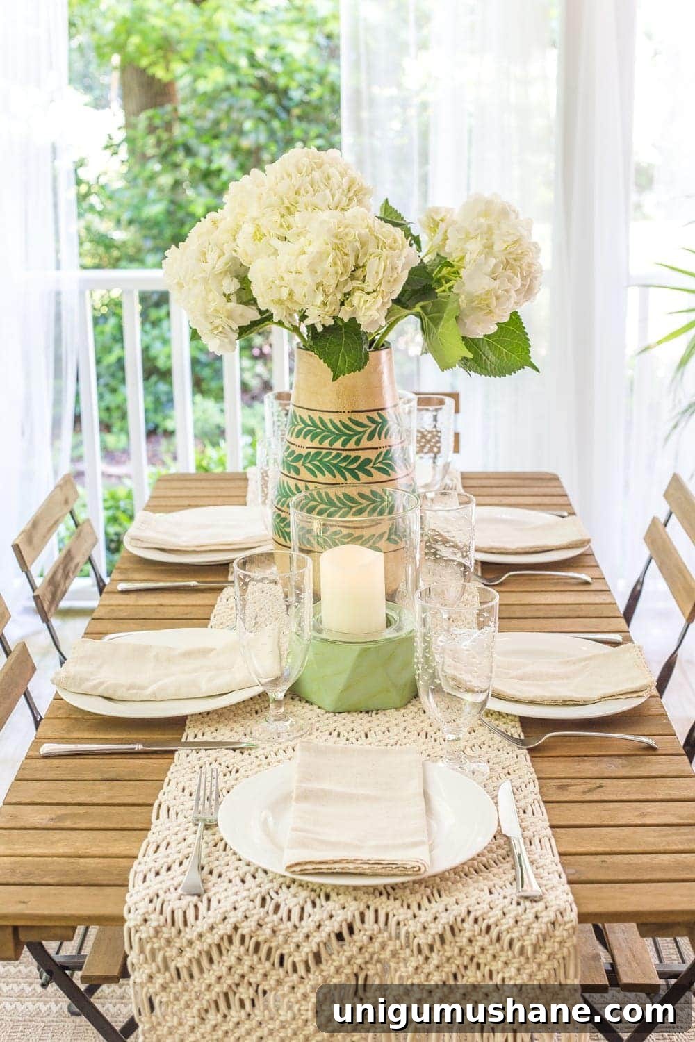 Boho Summer Back Porch Makeover Ideas 11 A tropical boho back porch decorated for summer with breezy, functional style from Flower Home and string lights for evening ambience.