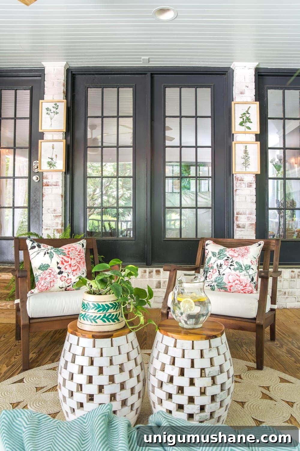 Boho Summer Back Porch Makeover Ideas 8 A tropical boho back porch decorated for summer with breezy, functional style from Flower Home and string lights for evening ambience.