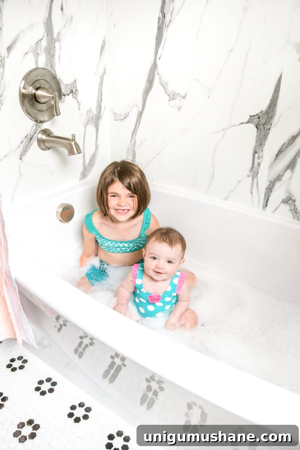 Whimsical, classic kids bathroom makeover | faux marble shower walls from American Standard