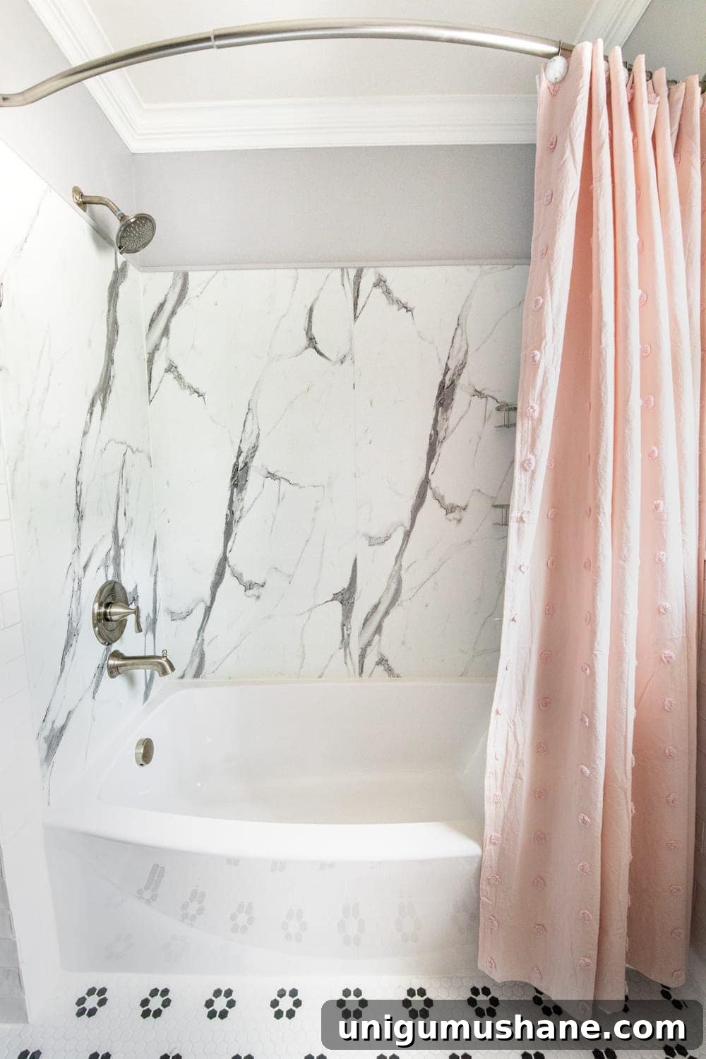 Whimsical, classic kids bathroom makeover | faux marble shower from American Standard Passage Collection and curved tub