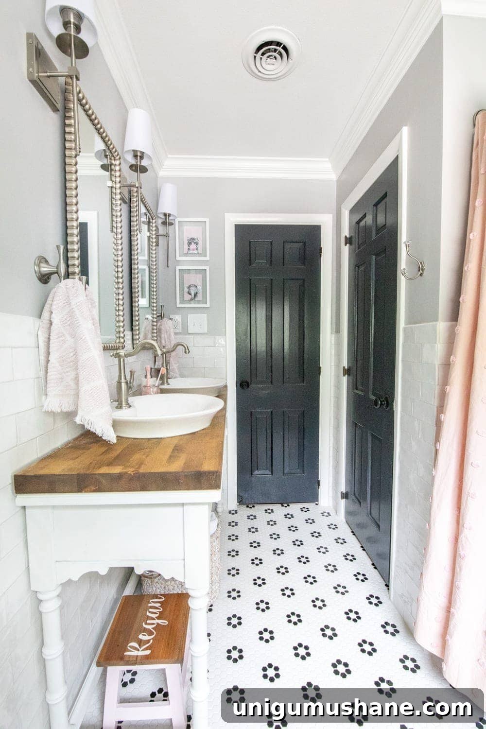 Girls' Bathroom Decor Details & Sources | Console table converted into a vanity with vessel sinks and retro flower floor tile | Benjamin Moore Stonington Gray walls and Benjamin Moore Wrought Iron doors