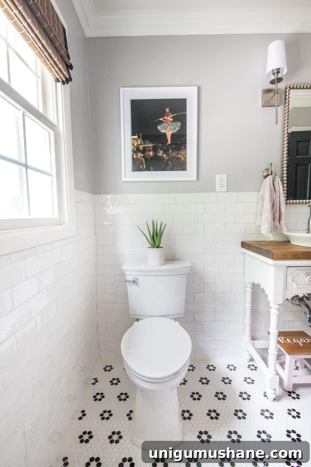 Girls' Bathroom Decor Details & Sources | Self cleaning toilet, retro flower floor tile, handmade subway wall tile, and vintage tightrope walker art