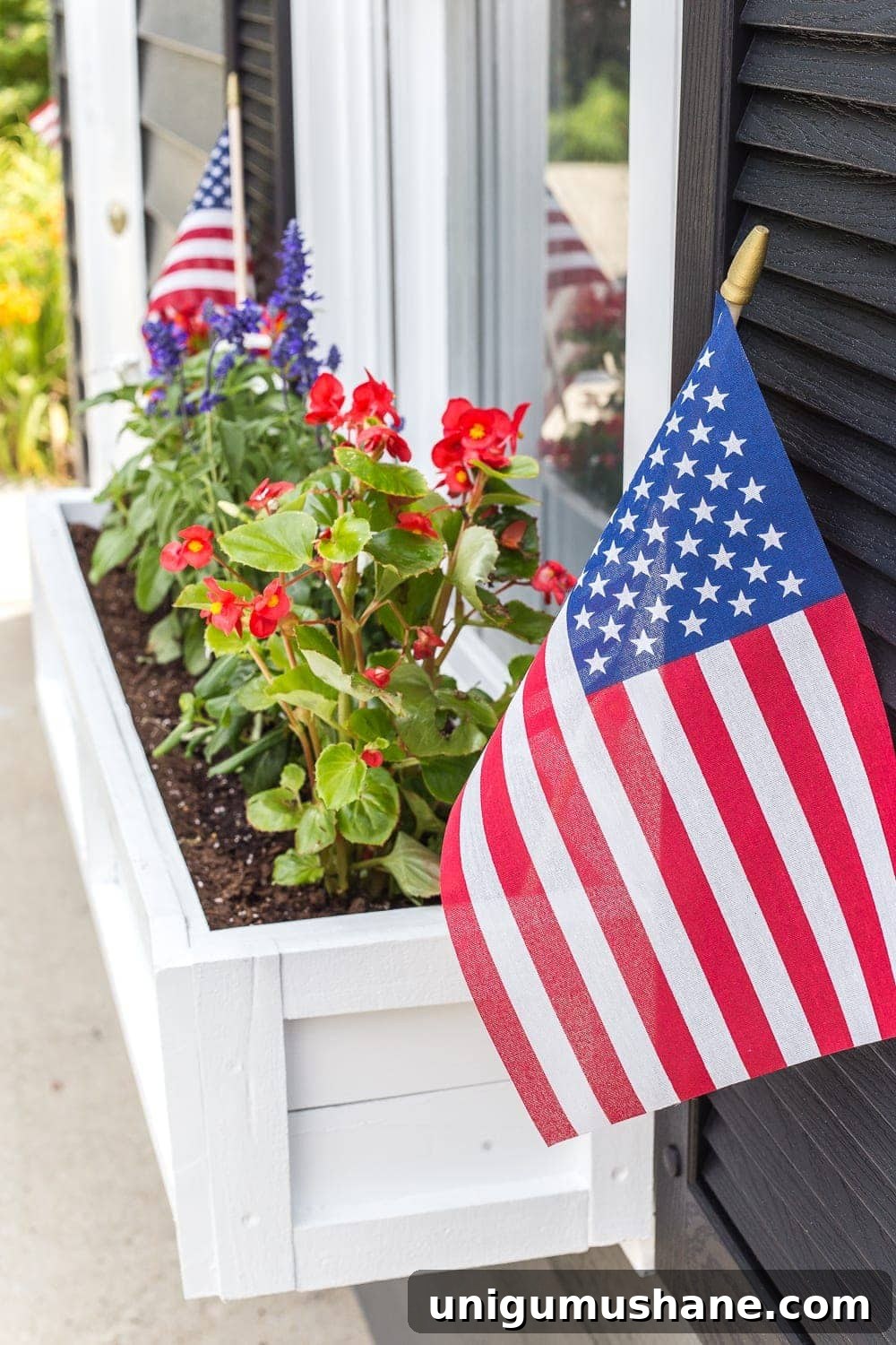 How to Build a Window Box Planter from Scrap Wood 15 DIY window box using scrap wood with red, white, and blue patriotic flowers for July 4th