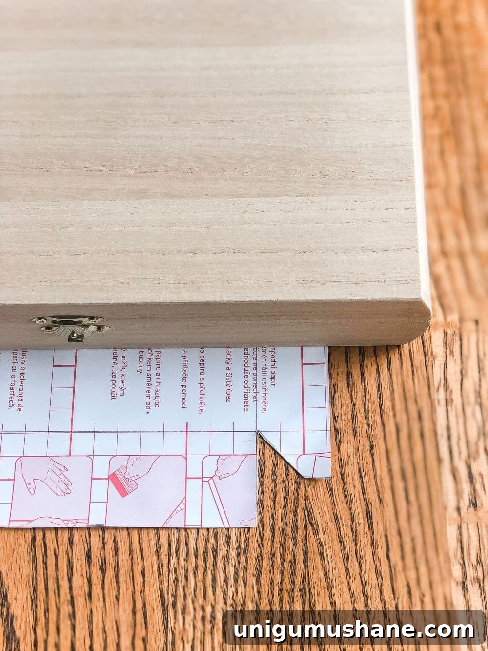 How to wrap a cigar box with contact paper to repurpose into a decorative remote control holder for a coffee table. #remotecontrolholder #coffeetabledecor