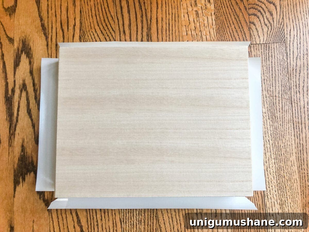 How to wrap a cigar box with contact paper to repurpose into a decorative remote control holder for a coffee table. #remotecontrolholder #coffeetabledecor