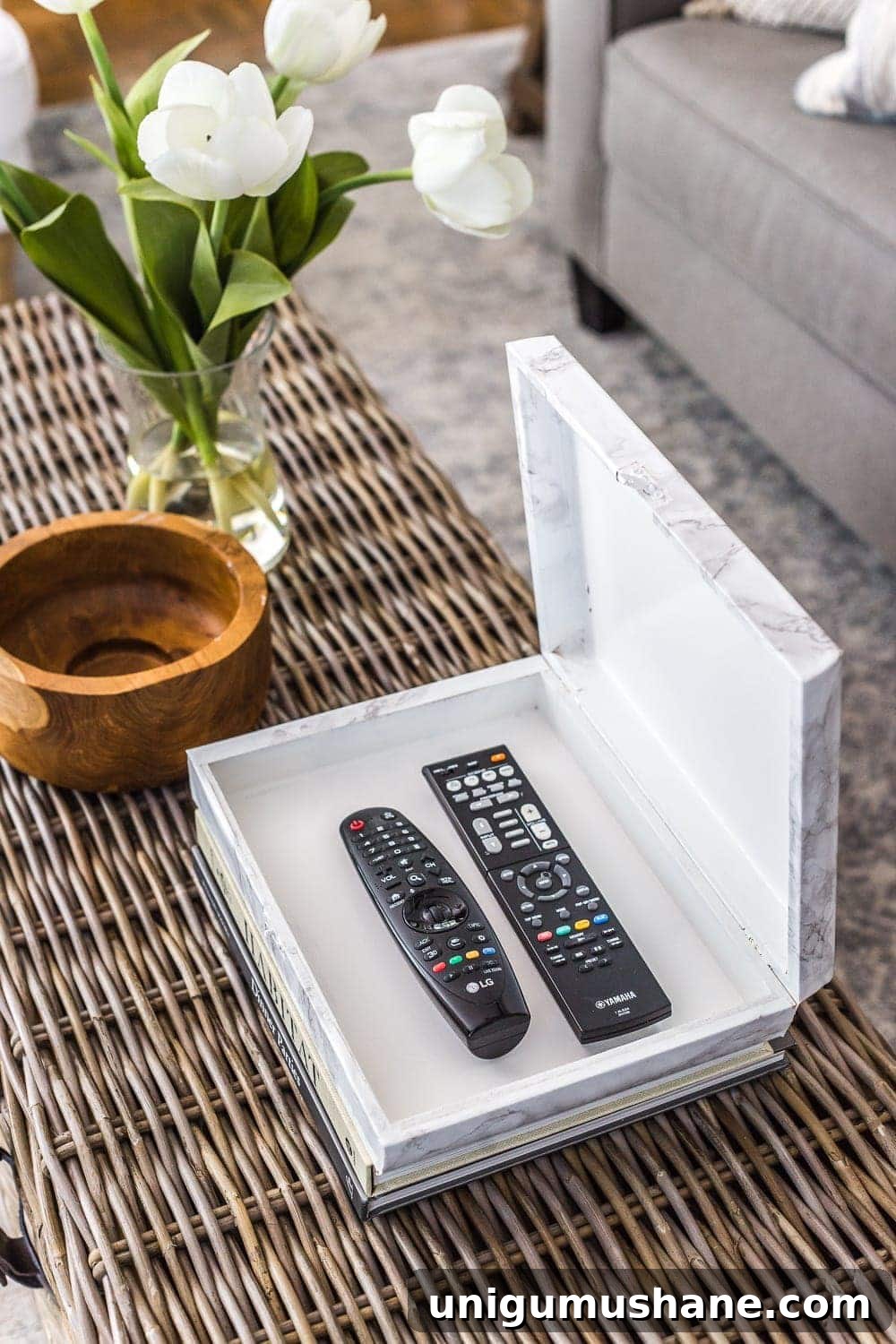 How to wrap a cigar box with contact paper to repurpose into a decorative remote control holder for a coffee table. #remotecontrolholder #coffeetabledecor