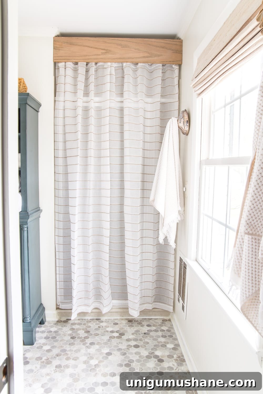 14 Budget-Friendly High-Impact Ways to Redecorate a Room 8 Big Impact Ways to Redecorate a Room Inexpensively | shower curtain hiding old shower door