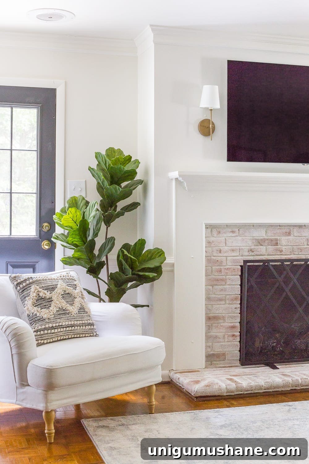 Keep your mantel simple with just a pair of sconces on either side of your TV.