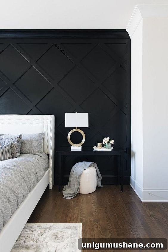 Black Paint Ideas for Dramatic Home Interiors 10 Rich black living room with dramatic art and layered rugs