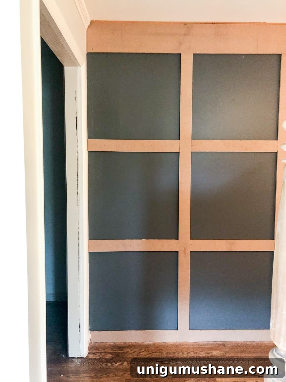 DIY Traditional Grid Molding Accent Wall 10 Preparing to install finger-joint molding