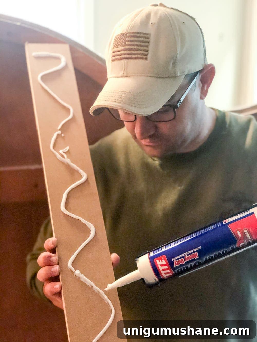 DIY Traditional Grid Molding Accent Wall 7 Applying vertical boards to wall