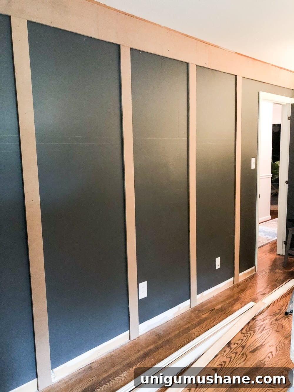 DIY Traditional Grid Molding Accent Wall 9 Adding horizontal boards to complete grid
