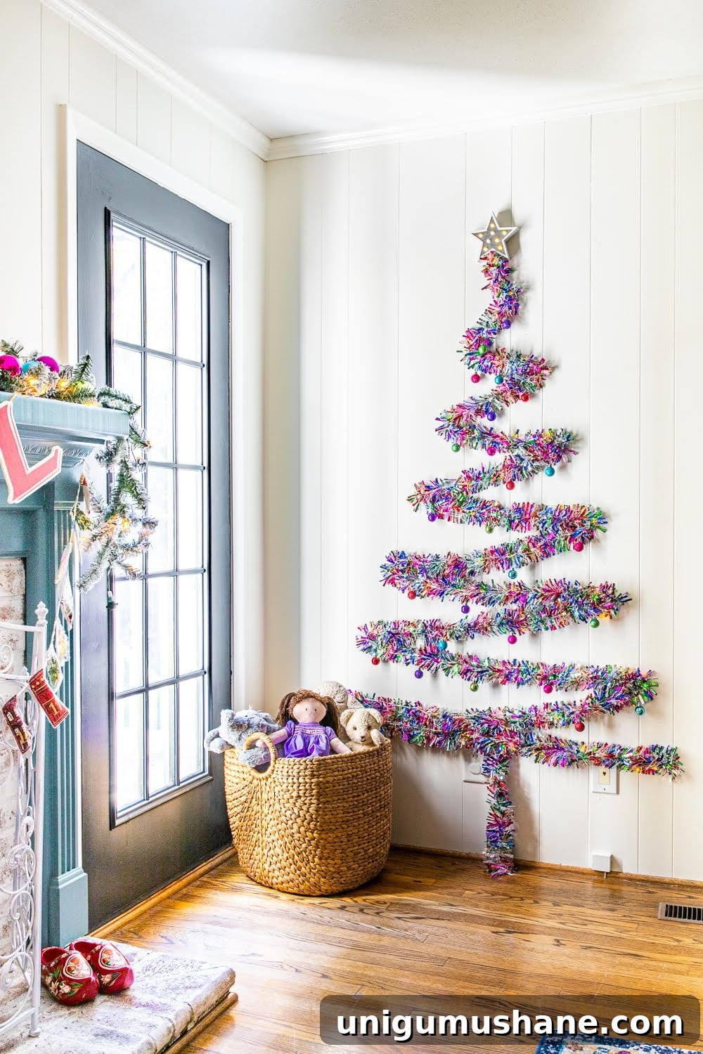wall Christmas tree made of garland and Command hooks