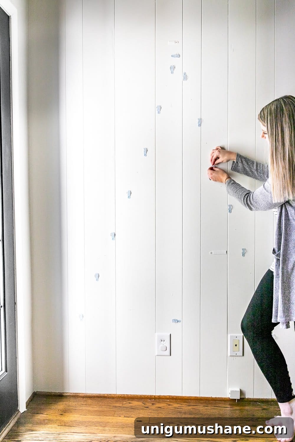 Hanging wall hooks in a triangle to make a tree shape