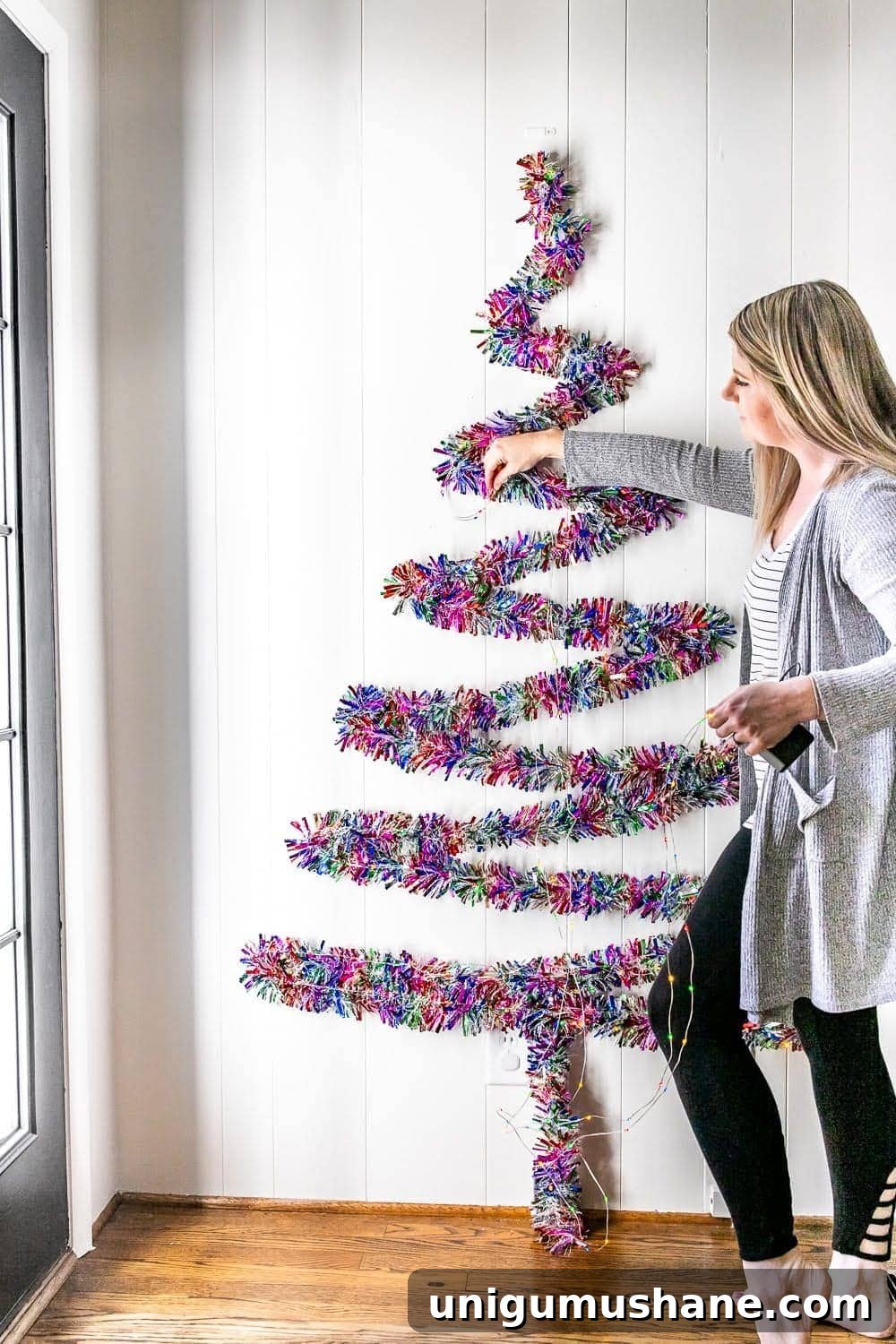 adding lights to a wall Christmas tree