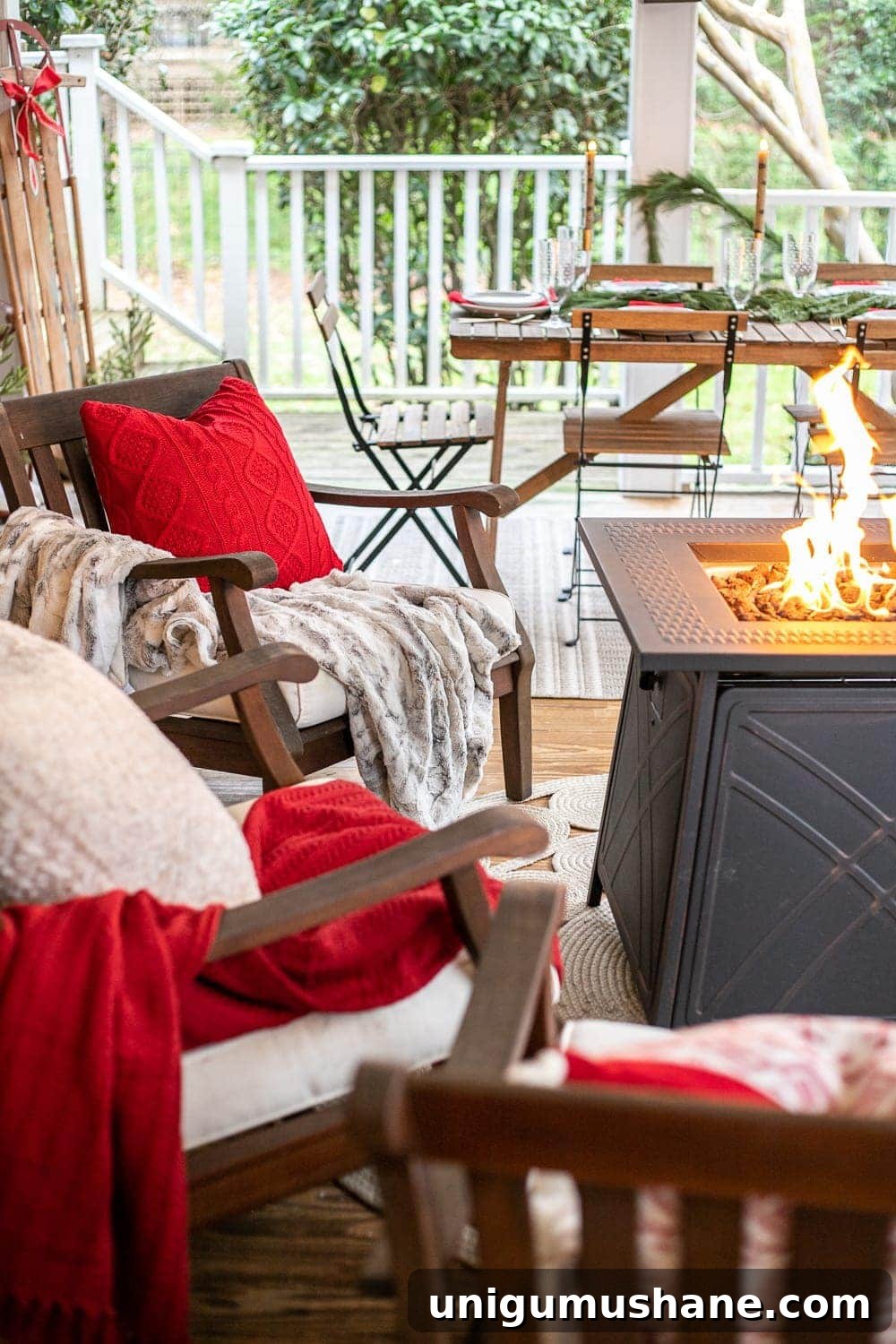 Cozy Christmas Decorating Ideas for Your Back Porch 8 Cozy Christmas back porch with red blankets and pillows and a fire pit table