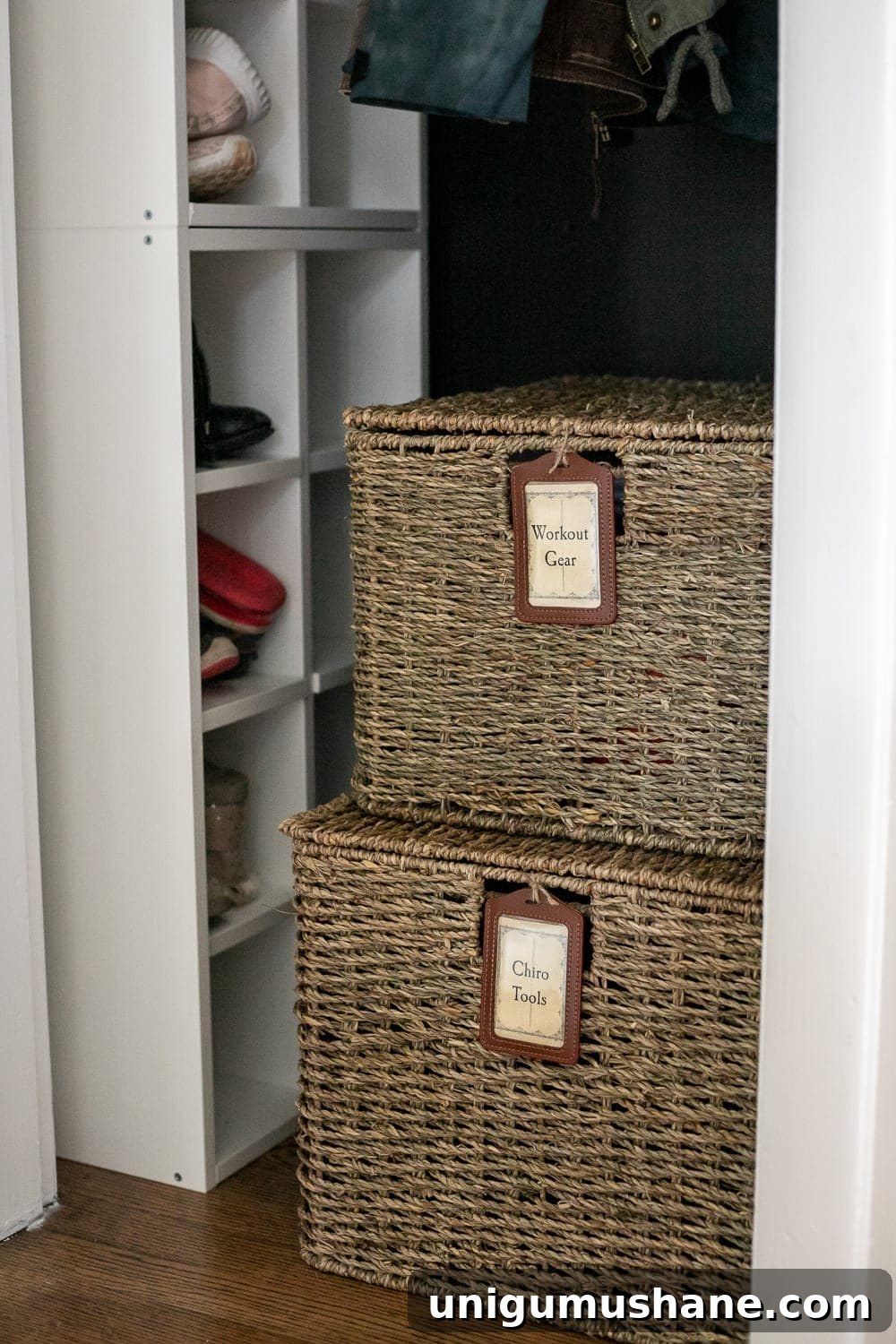 Coat Closet Organization: Practical Ideas for a Functional Space 8 lidded baskets with labels in a coat closet for organizing workout gear