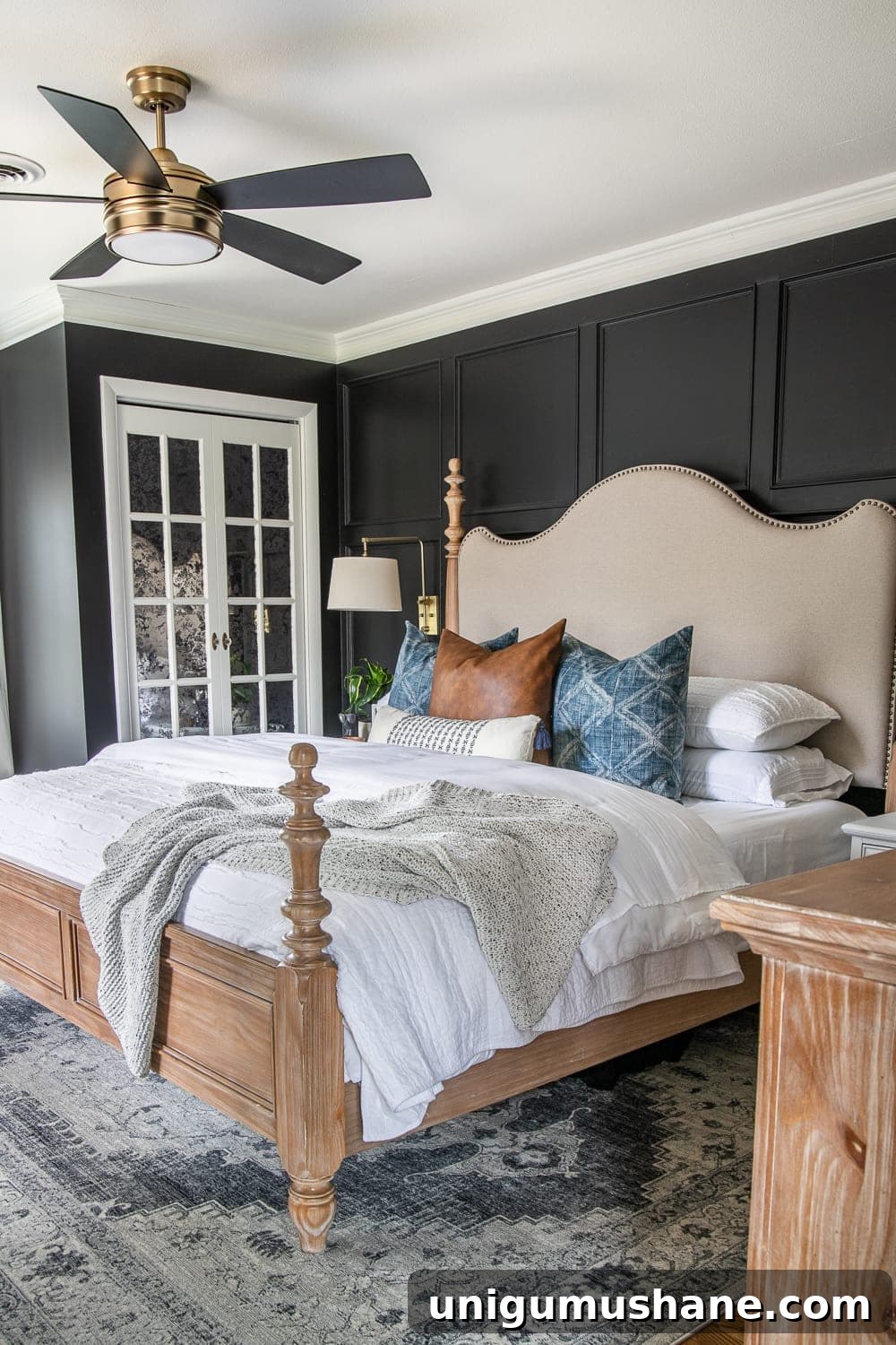 Moody Modern Vintage Master Bedroom Reveal and Design Ideas 15 A plain, dated master bedroom gets a modern vintage makeover with moody black paint, modern pillows, vintage style furniture, and budget DIY grid molding focal wall.