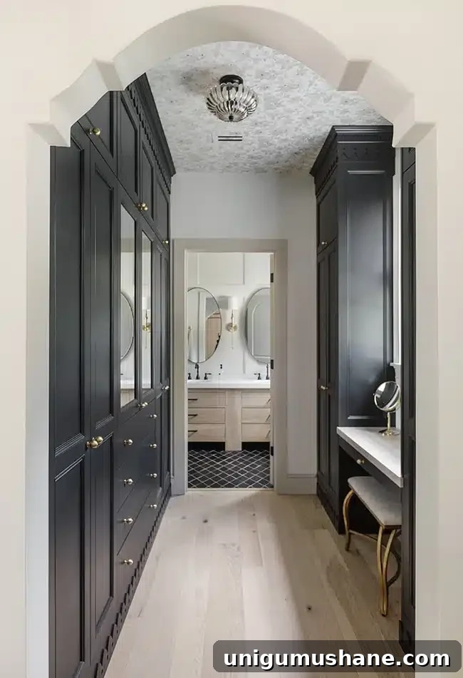 Black IKEA PAX wardrobes with doors and vanity in a primary en suite