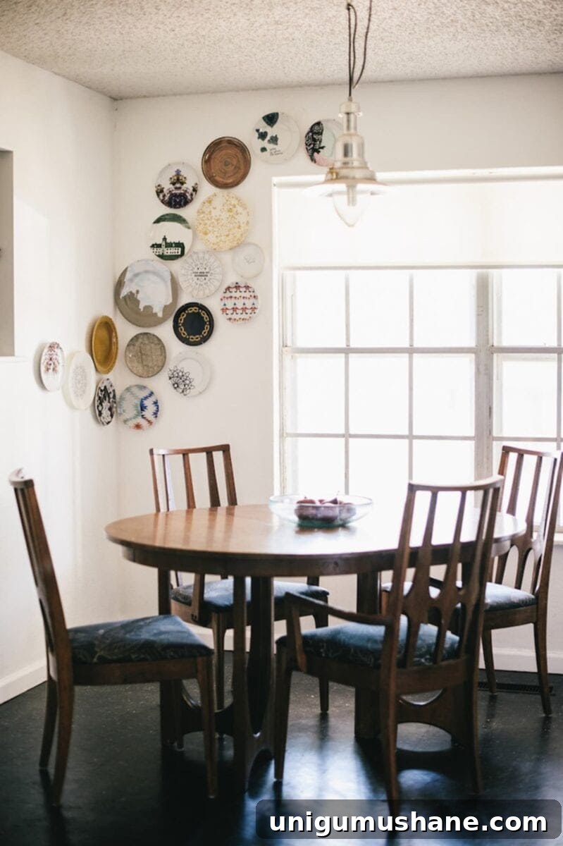 28 Creative DIY Wall Decor Ideas to Transform Your Blank Walls 11 a corner plate gallery wall in a dining room as thrifty DIY art
