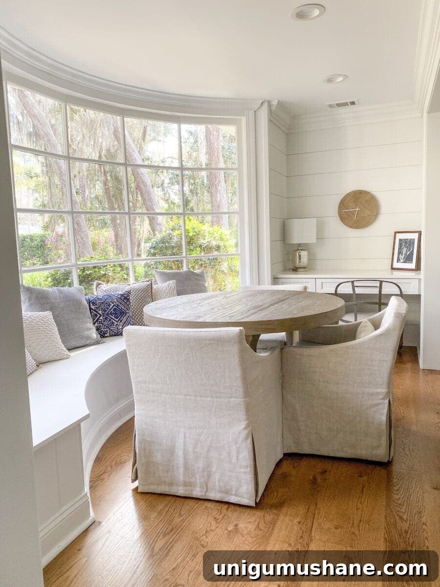 Sea Island Coastal Home Tour: Inside a Lowcountry House 9 Sea Island Coastal House Tour | coastal breakfast nook with window banquette