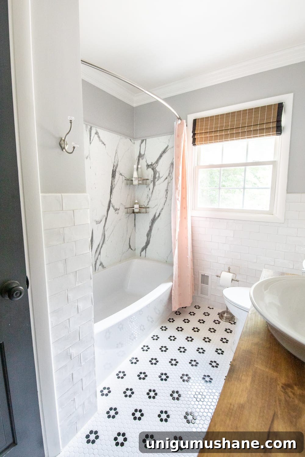 40 Affordable Home Decor Ideas Under $100 9 girls bathroom with pink shower curtain