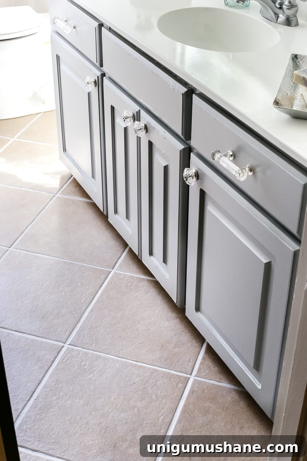 40 Affordable Home Decor Ideas Under $100 12 white tile grout with grout pen in a bathroom