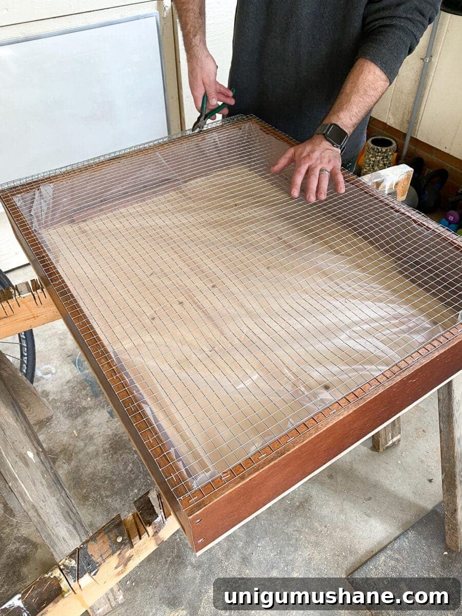 Build a Vertical Wall Planter from Reclaimed Wood 9 DIY Vertical Wall Planter | Trimming hardware cloth
